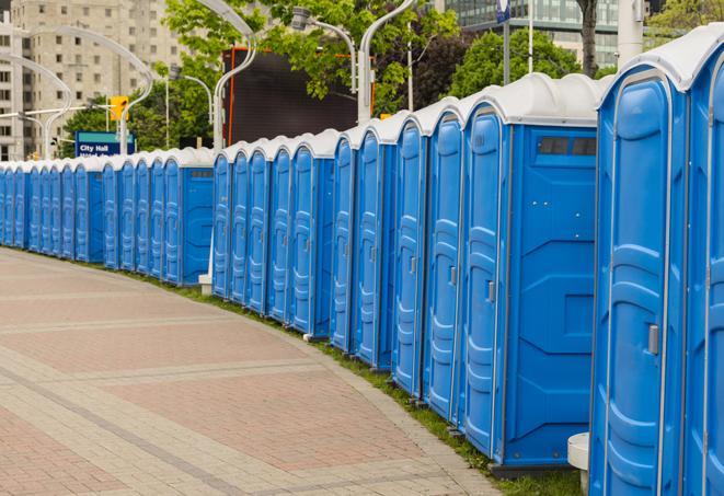 spacious portable restrooms equipped with hand sanitizer and waste disposal units in Harwood